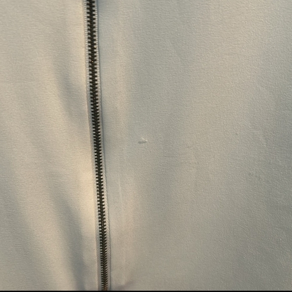 Bebe size medium. women's off-white zip, button tab sleeve, blouse - Picture 2 of 2